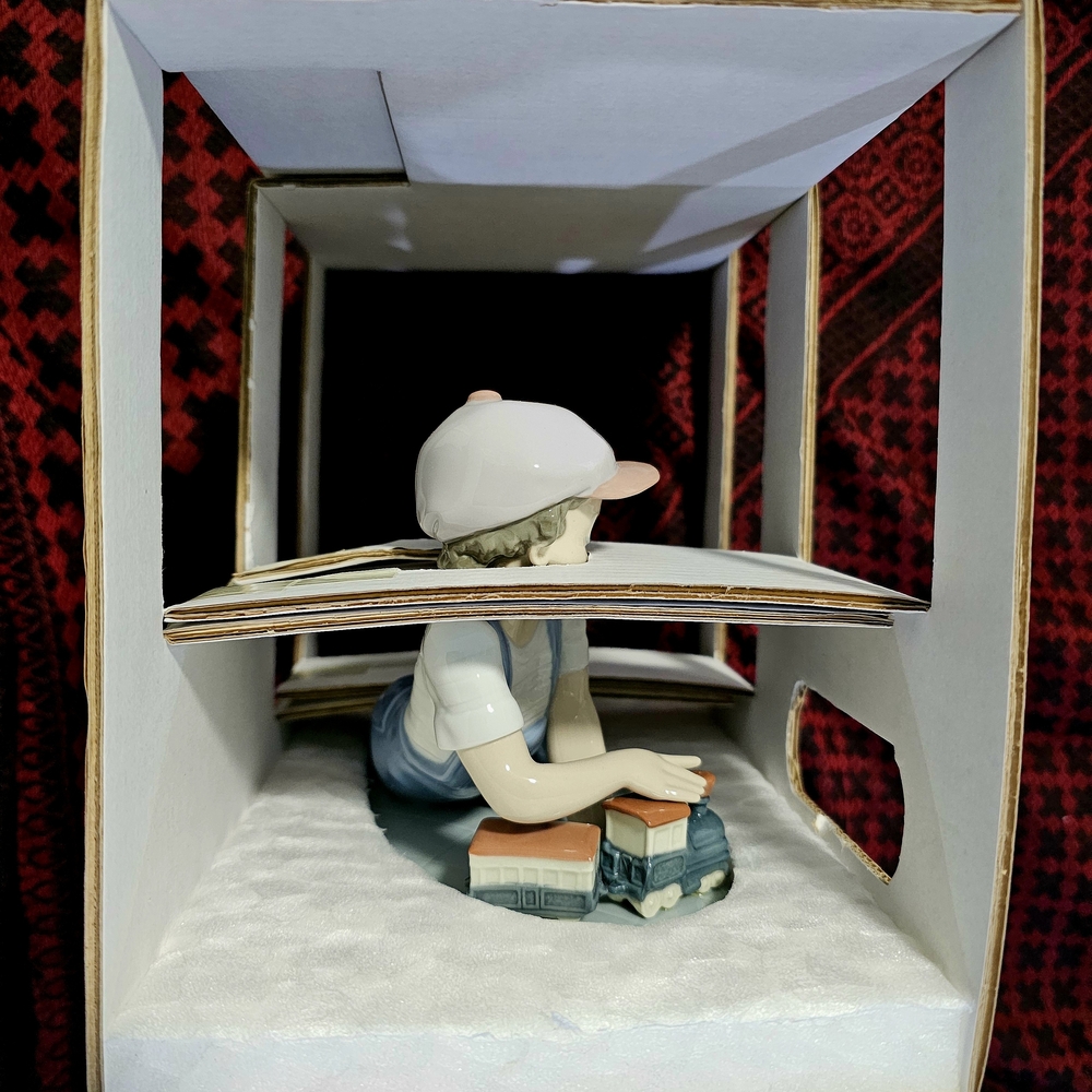 Lladro " All Aboard" Boy Playing with His Train
